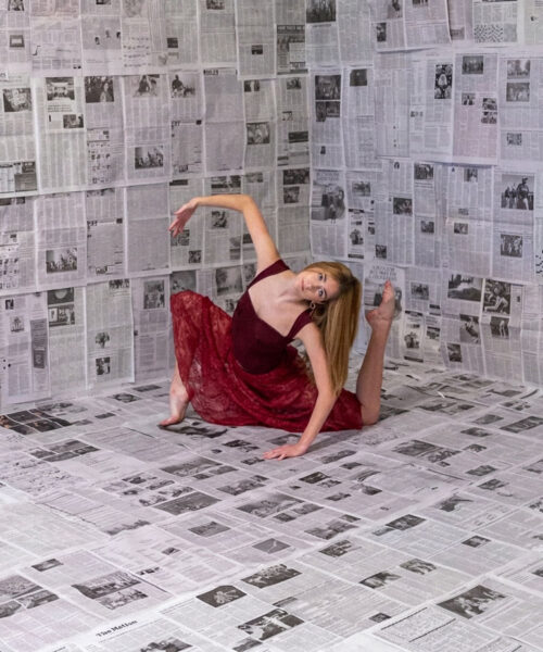 Ballet-teen-edited Teen posing on newspaper background in a ballet pose.