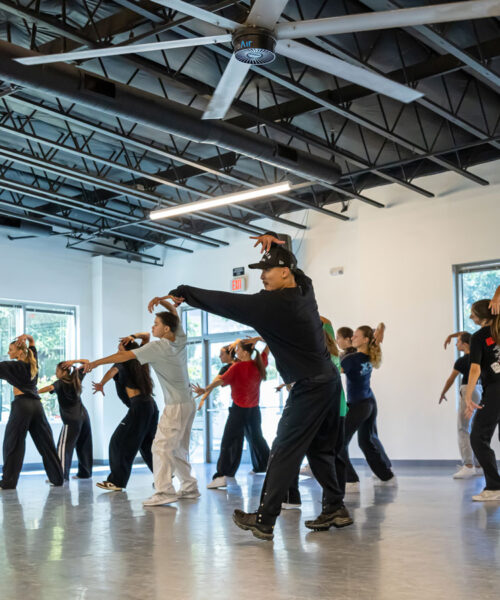 Hip Hop Dance teacher at Evolution Dance Center in Carlsbad, CA teaching Hip Hop dance to boy and girls.