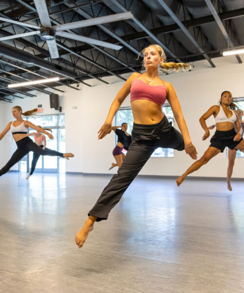 Jazz Young ladies jumping in a dance routine at Evolution Dance Center in Carlsbad, CA