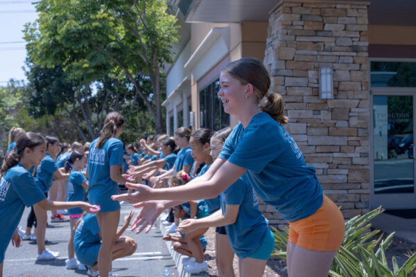 Young girls and boy having fun outside of Evolution Dance Center in Carlsbad, CA