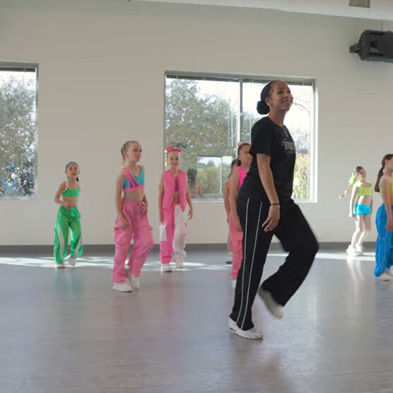 Dance instructor teaching young girls hip hop at Evolution Dance Center Carlsbad