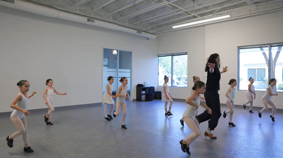 Dance instructor teaching young girls tap dance at Evolution Dance Center Carlsbad