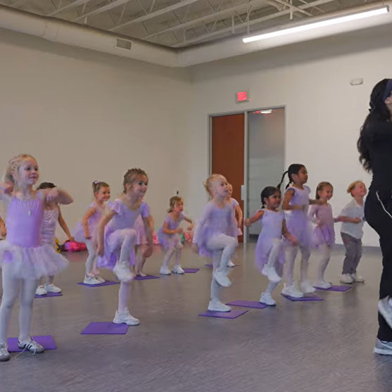 Dance instructor teaching young girls to dance Evolution Dance Center Carlsbad