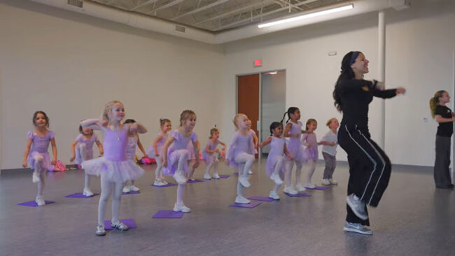 Dance instructor teaching young girls to dance Evolution Dance Center Carlsbad